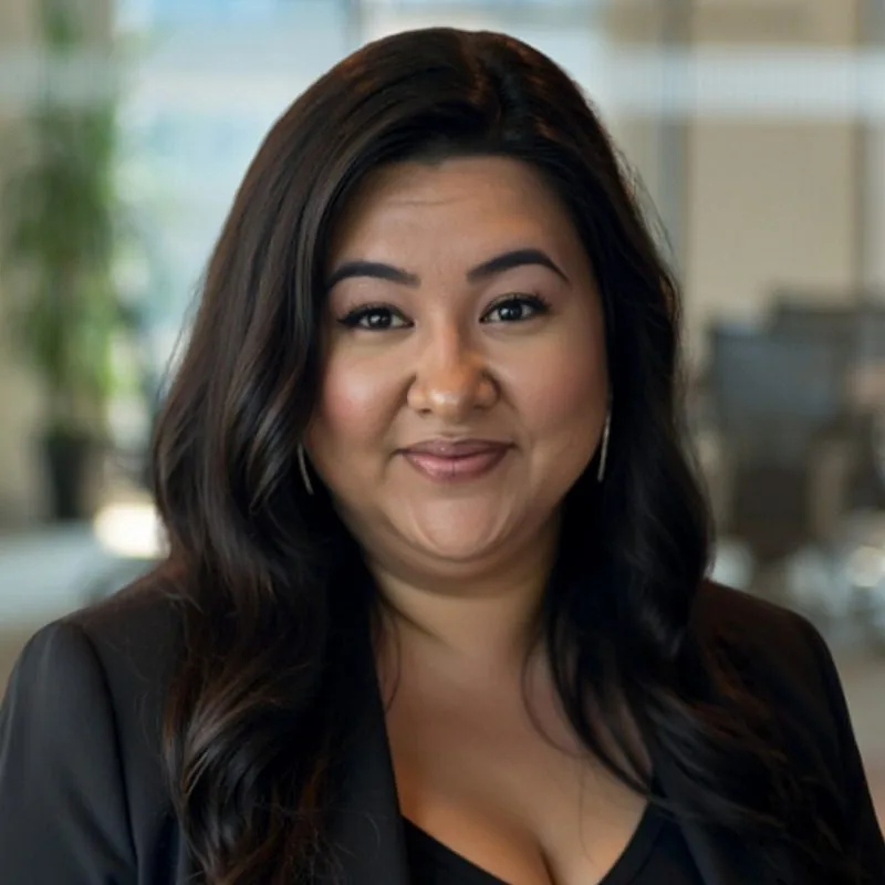 Stephanie Xhaferi - female with long dark hair wearing a V-neck shirt