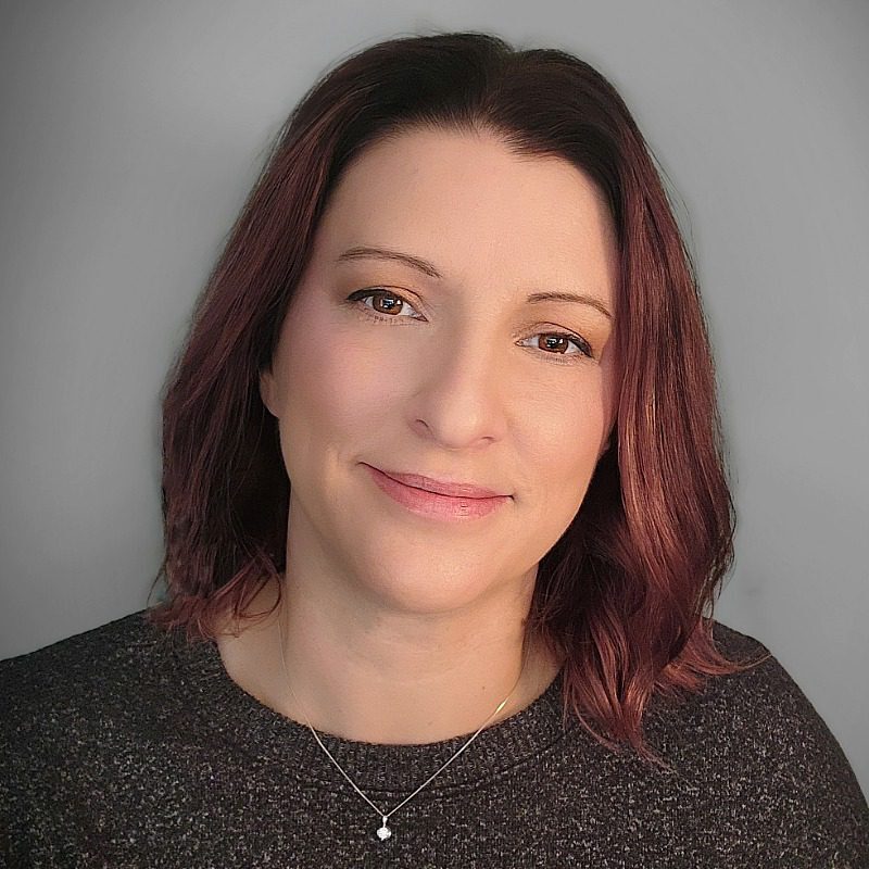 Female with shoulder length mahogany colored hair